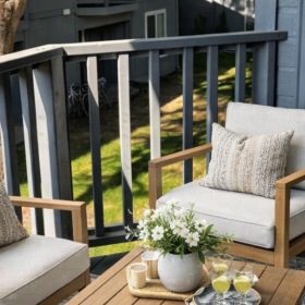 a deck with chairs and a table